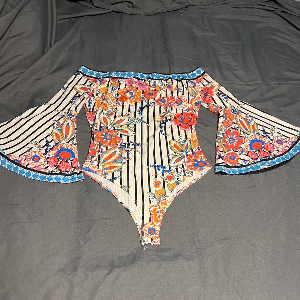 Worn once off the shoulder body suit